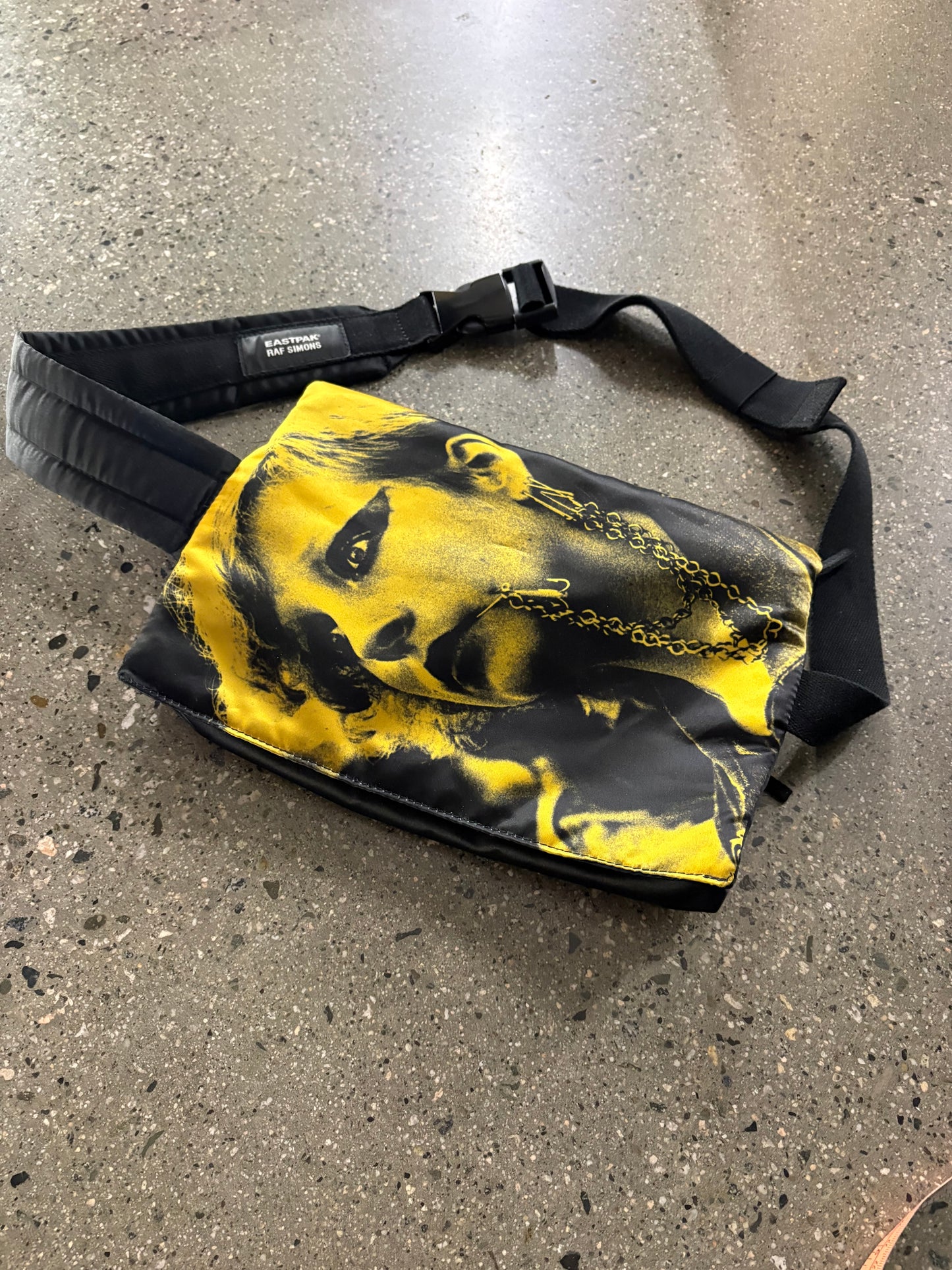 raf Simon’s punk poster crossbody