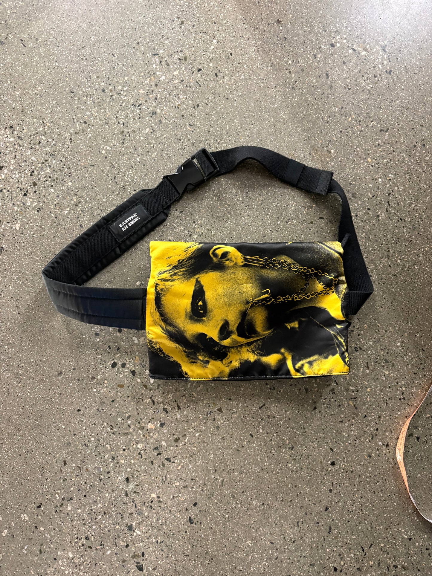 raf Simon’s punk poster crossbody