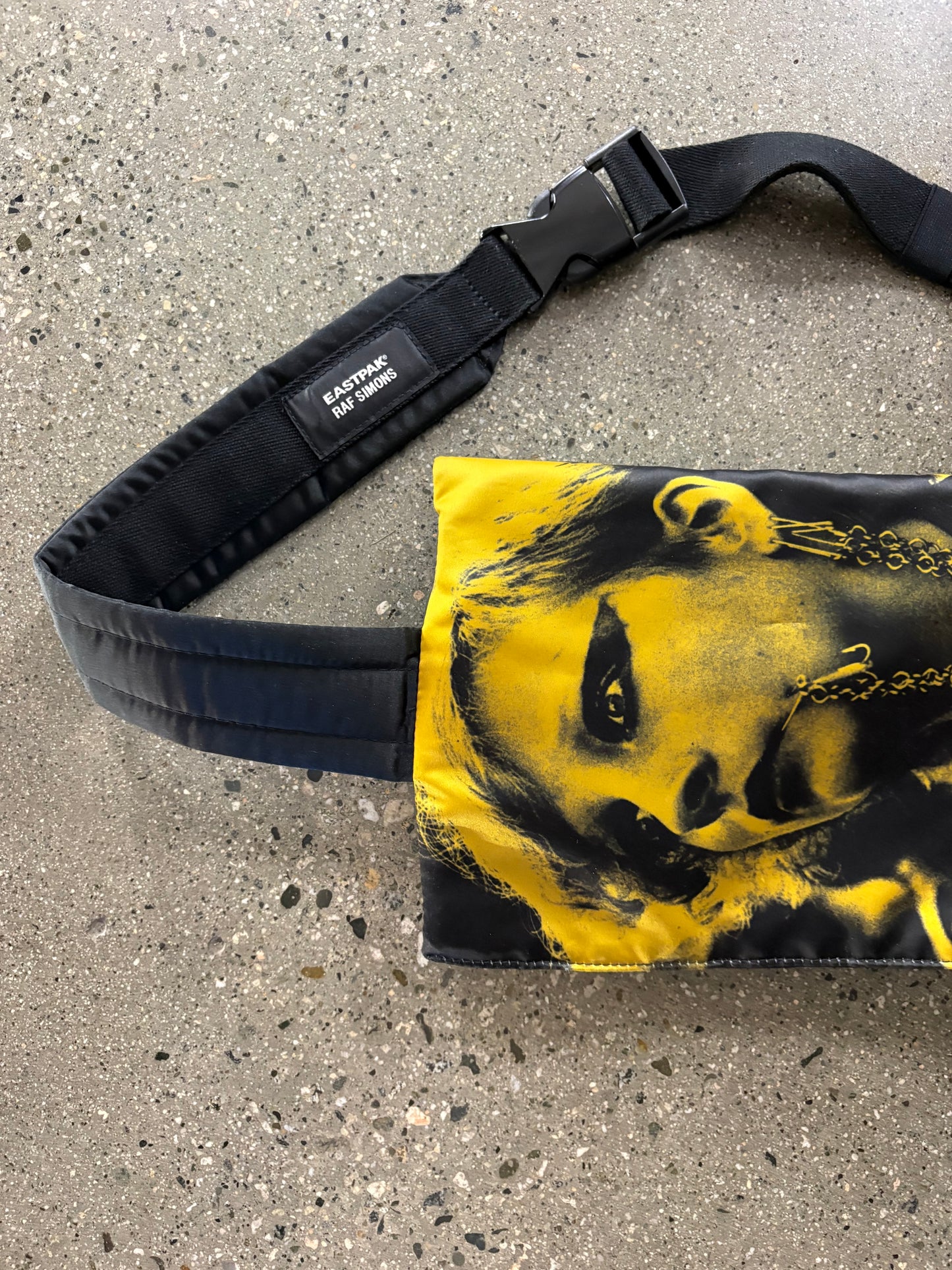 raf Simon’s punk poster crossbody